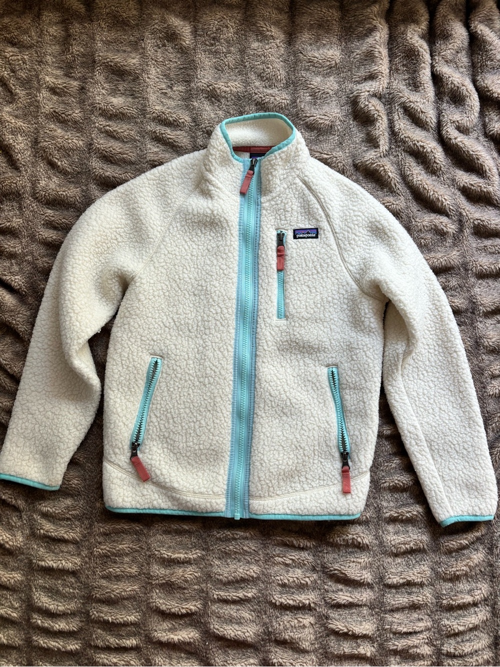 Patagonia Kids Cream Sherpa Jacket with Aqua Trim and Coral Pulls